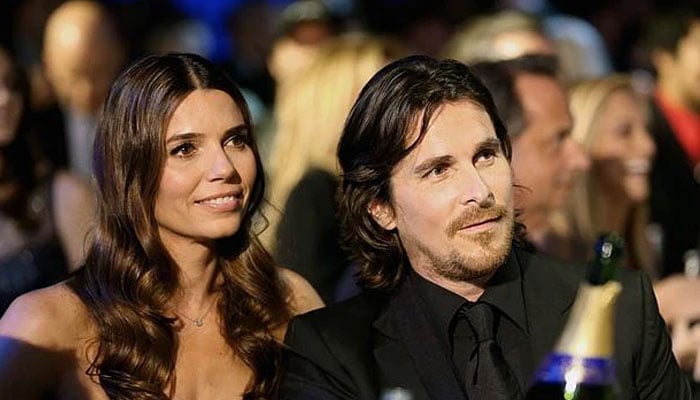 Christian Bale appears with family at fashion event