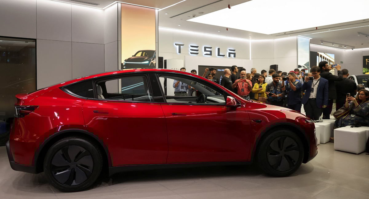 Media personnel take pictures and videos of the TESLA Model Y car at Indias first Tesla showroom in Mumbai, India, July 15, 2025. — Reuters