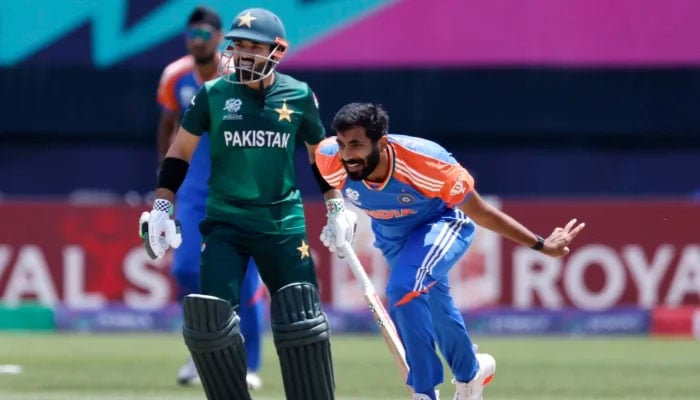 Indian pacer Jasprit Bumrah pictured alongside Pakistans Mohammad Rizwan during the ICC Mens T20 World Cup 2024 match against Pakistan on June 9, 2024. — AFP
