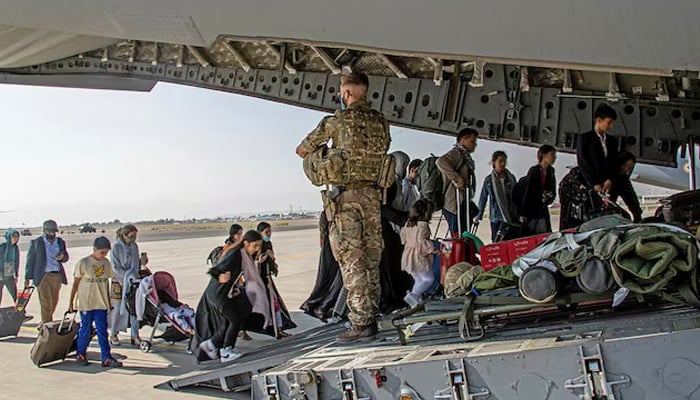 British citizens and dual nationals residing in Afghanistan board a military plane for evacuation from Kabul airport, Afghanistan, on August 16, 2021. — Reuters