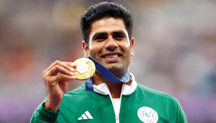 Gold medallist Arshad Nadeem celebrates with his medal on the podium during the Paris 2024 Olympics Mens Javelin Throw Victory Ceremony at the Stade de France, Saint-Denis, France on August 9, 2024. — Reuters
