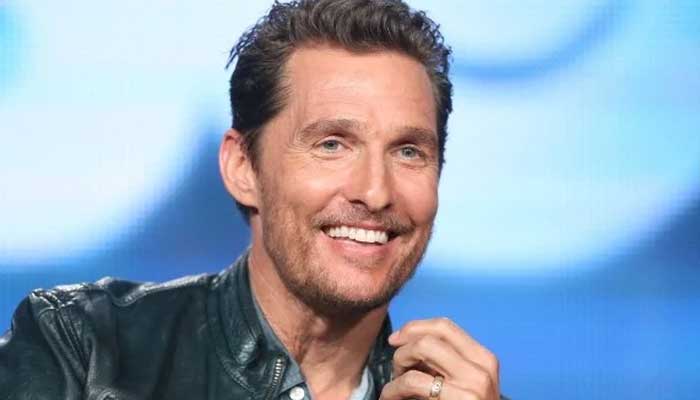 Legend poses for pictures with Matthew McConaughey