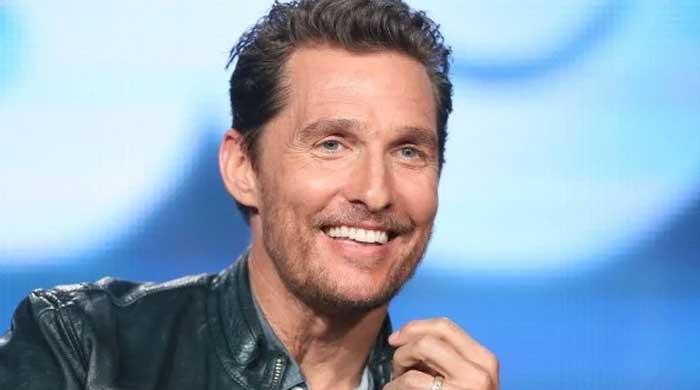 Tennis legend poses for pictures with Matthew McConaughey