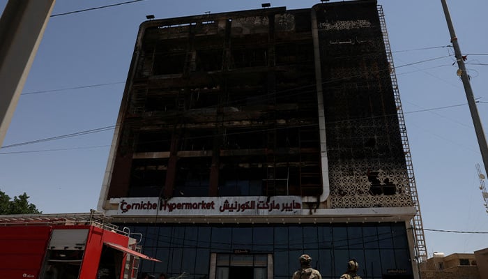 A fire truck stands next to the wreckage of a five-storey shopping center, after a massive overnight fire killed dozens of people, in al-Kut, Wasit province, Iraq, July 17, 2025. — Reuters