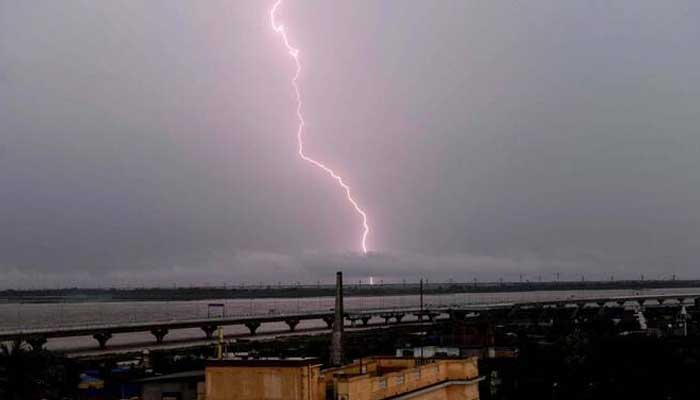 Lightning strikes over the grey sky during monsoons in Patna on July 16, 2025. — AFP