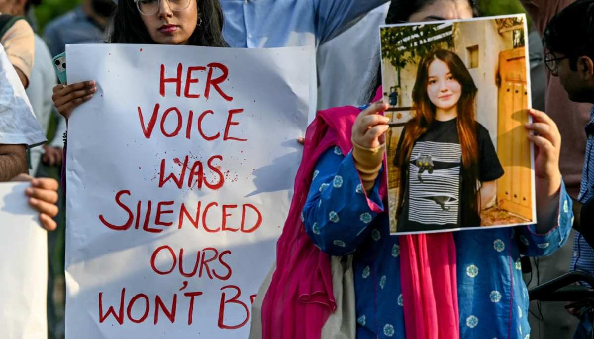 Women activists holding posters and photographs of content creator Sana Yousaf take part in a demonstration condemning violence against women, in Islamabad on June 5, 2025. — AFP