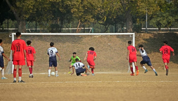 Young men playing football in this undated image. — Facebook@PakistanSportsBoard