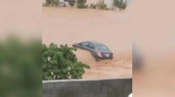 Car swept away in Islamabad after heavy rains lash twin cities