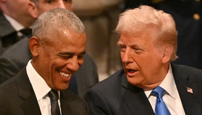 Former President Barack Obama speaks with President Donald Trump. —AFP/File