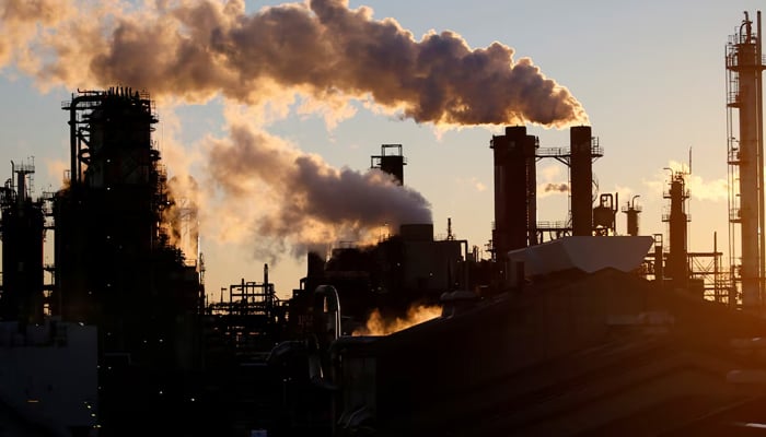 Smoke rises from a factory in this representational image. — Reuters
