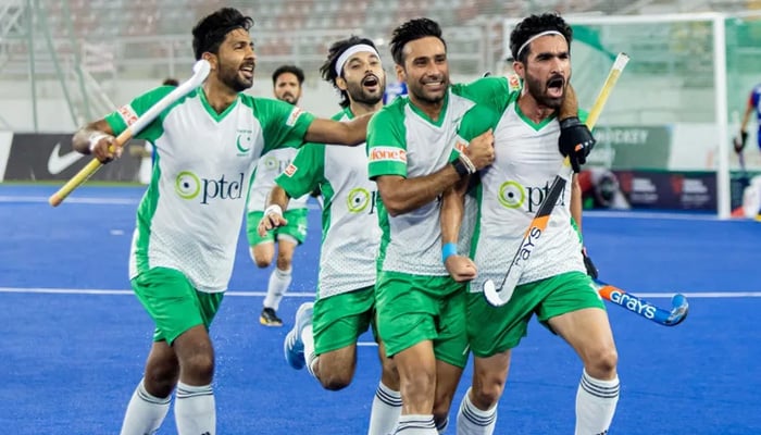 Pakistans hockey players celebrate during a match in this undated image. — FIH website