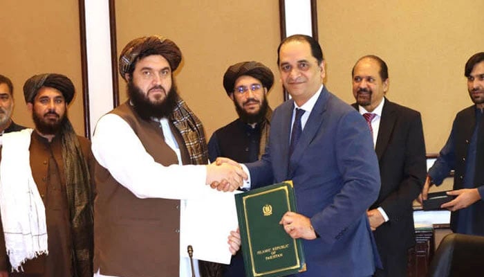 Pakistan’s Deputy Commerce Minister Jawad Paul shakes hands with Mullah Ahmadullah Zahid, Deputy Minister at Afghanistan’s Ministry of Industry and Commerce, following a signing of a Preferential Trade Agreement in Islamabad on July 23, 2025. — X@AfghanEmbPak