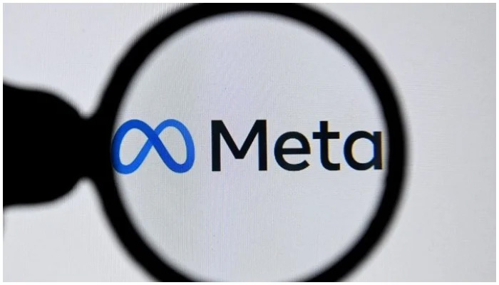Image showing the logo of Meta through a magnifying glass. — AFP/File
