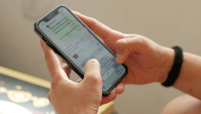 This representational image shows a person texting on a smartphone. — Unsplash