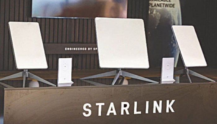 A representational image showing Starlink logo at the companys stall during an exhibition. — AFP/File