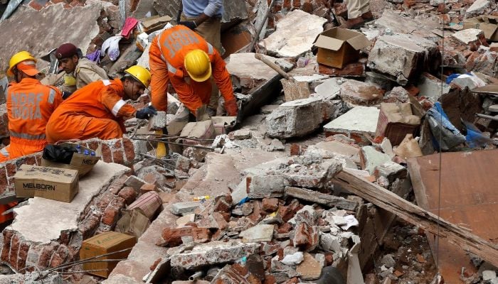 Representational image shows rescue workers search for survivors at the site of a collapsed building in Mumbai, August 31, 2017. — Reuters