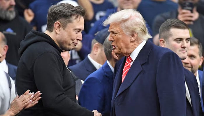 Elon Musk and President Donald Trump during the Division I Mens Wrestling Championship held at Wells Fargo Centre, Mar 22, 2025. — Reuters