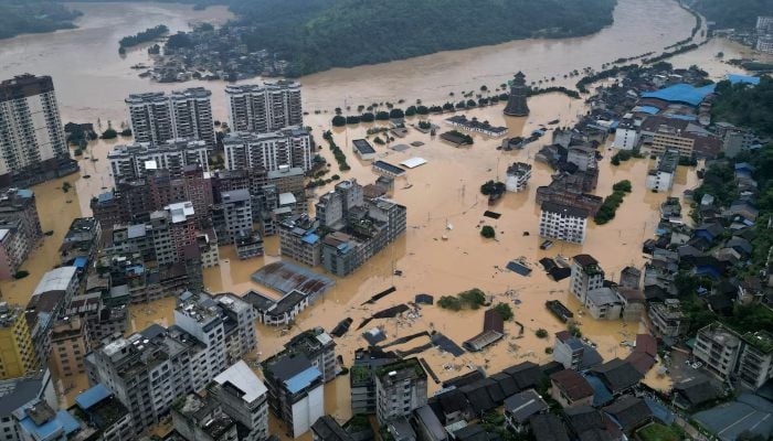 A drone view shows buildings and roads are half submerged in floodwaters after heavy rainfalls, in Rongjiang county, Guizhou province, China June 24, 2025. — Reuters