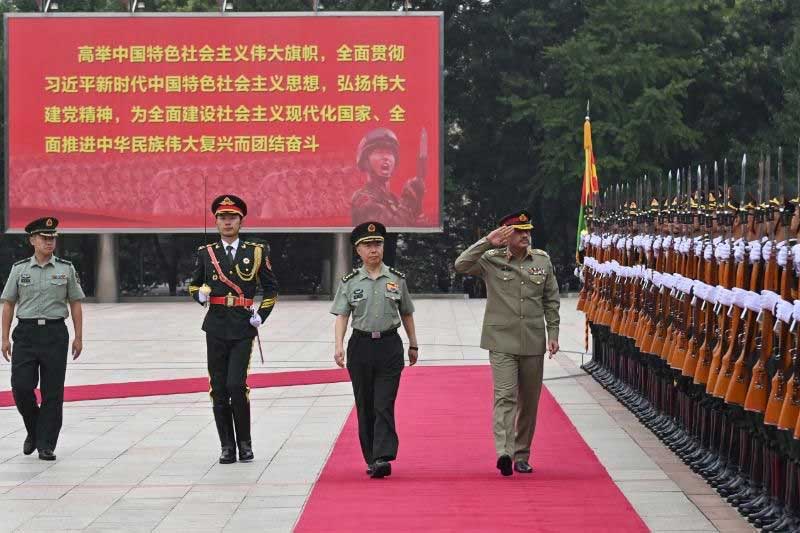 COAS Asim Munir was presented with a guard of honour at the PLA Army Headquarters. — ISPR