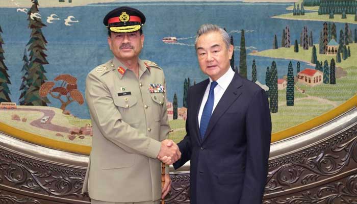 COAS Field Marshal Asim Munir (left) meets Chinese Foreign Minister Wang Yi in Beijing on July 24, 2025. — Xinhua