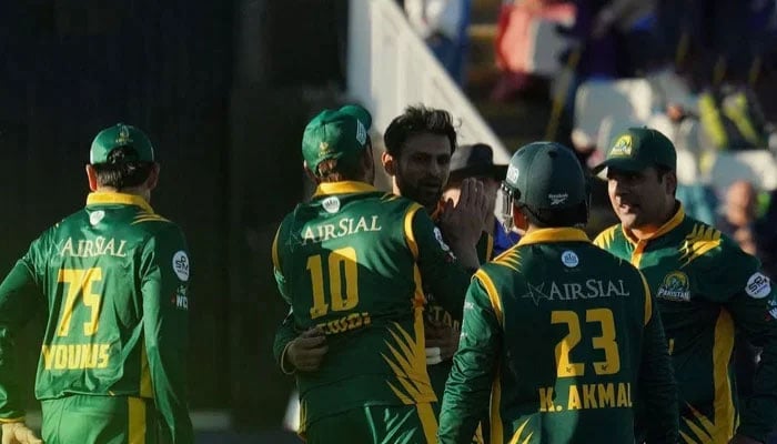 Pakistan Champions Shoaib Malik (centre) celebrates taking a wicket with teammates during their World Championship of Legends match in Northampton. — Instagram@wclpakistanchampions