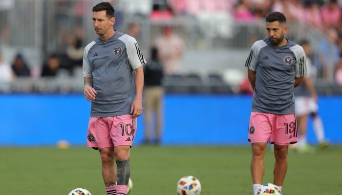 Inter Miamis Argentine forward Lionel Messi and Inter Miamis Spanish defender Jordi Alba warm up ahead of the Major League Soccer (MLS) regular season football match between Inter Miami CF and St Louis CITY SC at Chase Stadium in Fort Lauderdale, Florida in June 1, 2024. — AFP