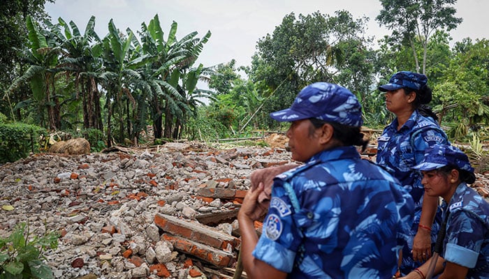 Security officials are on guard at a demolition site in the Goalpara district in the northeastern state of Assam, India, July 18, 2025. - Reuters