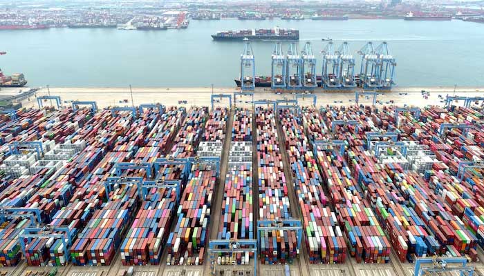 An aerial view shows containers and cargo vessels at the Qingdao port in Shandong province, China May 9, 2022. — Reuters