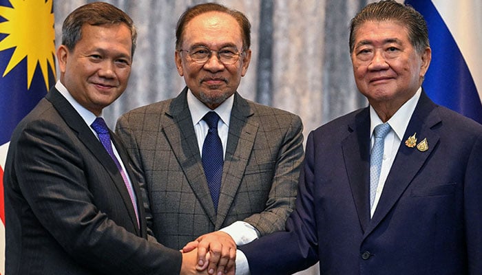 Cambodias Prime Minister Hun Manet, Malaysias Prime Minister Anwar Ibrahim and Thailands acting Prime Minister Phumtham Wechayachai shake hands in Putrajaya, Malaysia on July 28, 2025. — Reuters