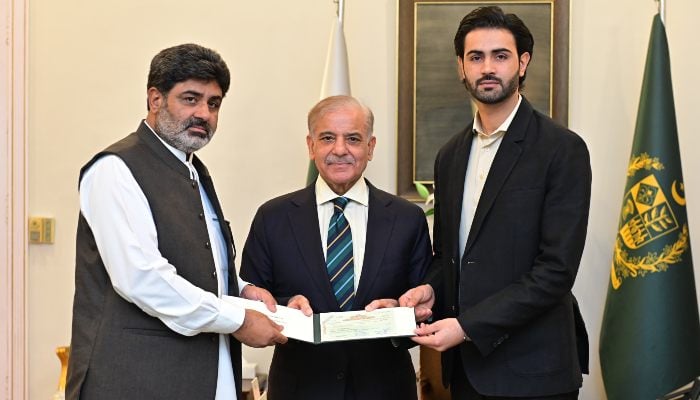 Prime Minister Shehbaz Sharif with MMA fighter Shahzaib Rinds father (left). — X/@GovtofPakistan