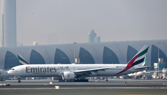 A picture taken on January 30, 2023 at Dubai airport, shows the first milestone demonstration flight on a Emirates Boeing 777-300ER. — AFP