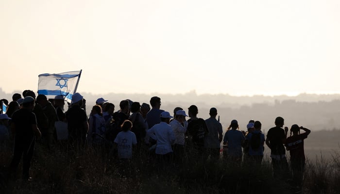 Israeli right-wing activists take part in a rally organised by settler groups to promote Israels resettling in Gaza, the Israel-Gaza border, July 30, 2025. — Reuters