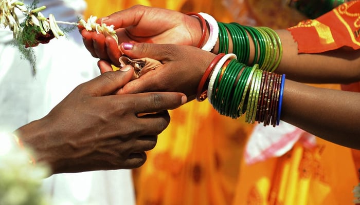 A representational image of a newly-weded couple. — AFP/File