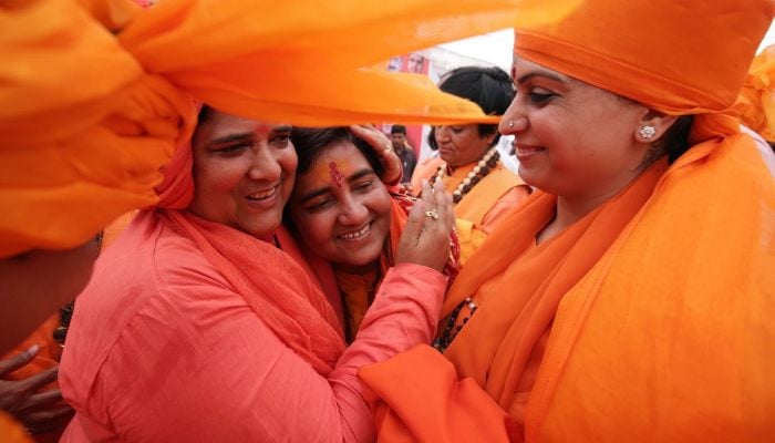 Pragya Singh Thakur (center) is welcomed during a rally before filing her nomination in the parliamentary elections in Bhopal in April, 2019. — AFP