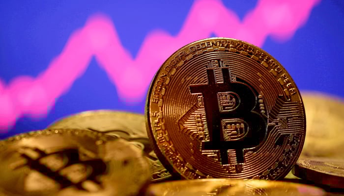 A representation of virtual currency Bitcoin is seen in front of a stock graph in this illustration taken January 8, 2021. — Reuters