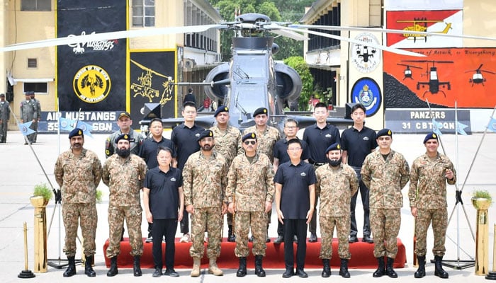 Field Marshal Asim Munir and other senior officials pose in front of the newly-inducted Z-10ME attack helicopter into Pakistan Army Aviation during a ceremony held on August 2, 2025. — ISPR