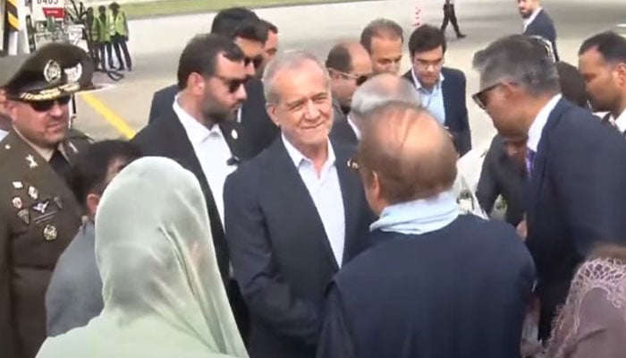Iranian President Masoud Pezeshkian (centre) arrives at Allama Iqbal International Airport in Lahore, on August 2, 2025. — Geo News