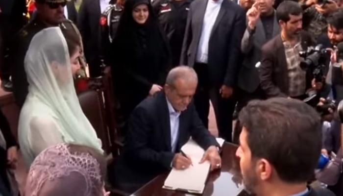 Iranian President Masoud Pezeshkian recording his remarks in the visitors book at Allama Iqbals mausoleum in Lahore, August 2, 2025. — Screengrab via Geo News