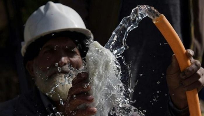This representational image, taken on September 20, 2017, shows an elderly Pakistani labourer washing a piece of rock outside a mine at a mountain to find gemstones in the town of Chitta Katha in Upper Neelum Valley in AJK. — AFP
