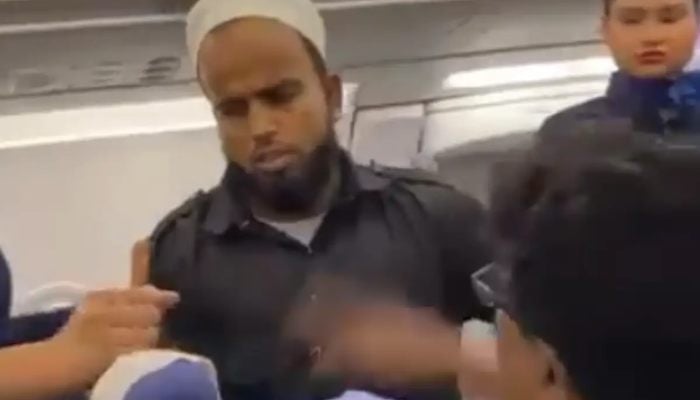 Image taken from a video shows the moment when a passenger was slapped on an IndiGo flight. — X/@adilsiddiqui7