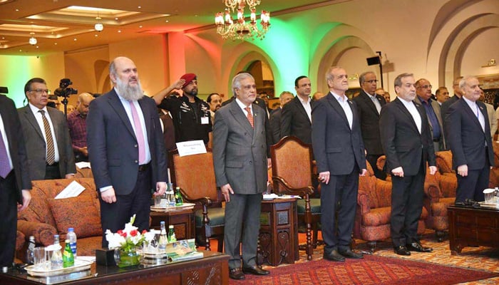 Iranian President Dr Masoud Pezeshkian, Deputy Prime Minister Ishaq Dar, Federal Minister for Commerce Jam Kamal Khan, and Iranian Minister Mohammad Atabak stand in respect during the national anthems of both countries at the Pakistan-Iran Business Forum. — APP