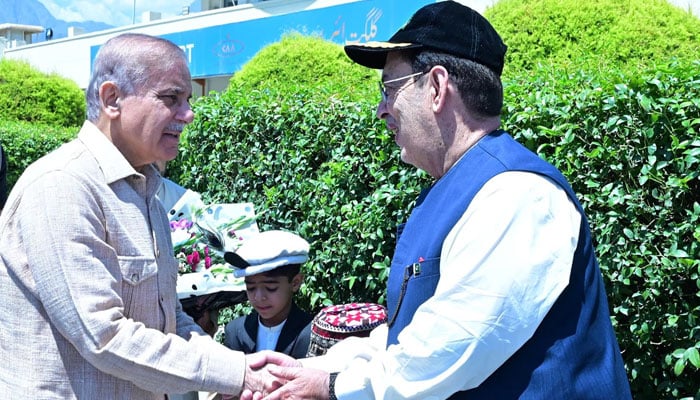 PM Shehbaz Sharif shakes hands with Gilgit Baltistan Governor Mehdi Shah on August 4, 2025. — PID