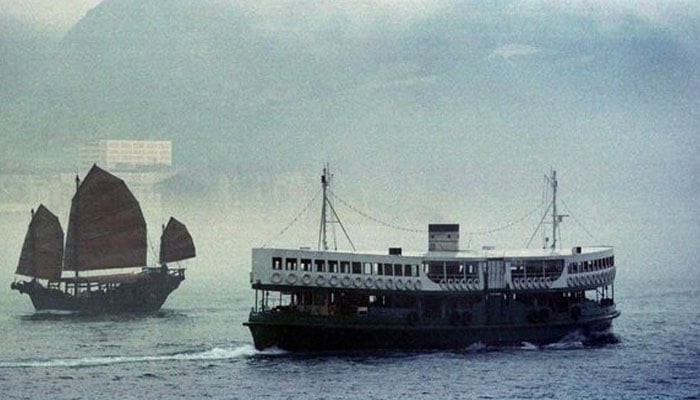 This representational images shows fog shrouds one of Hong Kongs double-decker Star Ferries as it passes a Chinese-style junk sailing through Hong Kongs eastern harbour February 20, 2022. — Reuters