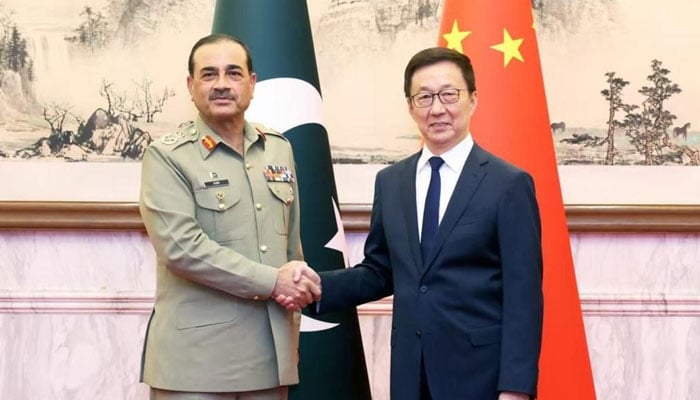 Field Marshal Asim Munir shakes hands with Chinese Vice President Han Zheng in this image released on July 25, 2025. — Facebook@ISPROfficial1