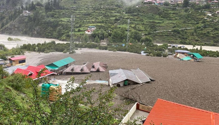 Houses are partially buried by a mudslide, amid flash floods, in Dharali, Uttarakhand, India, August 5, 2025. — Reuters