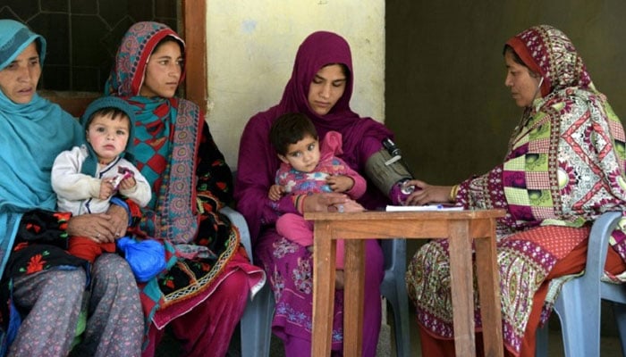 Pakistani health worker speaks with pregnant women at a healthcare centre in the town of Sharda in the mountainous Neelum Valley. — AFP/File