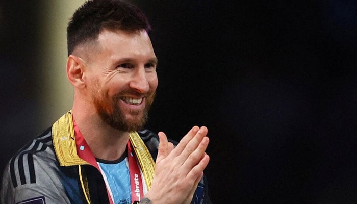 Argentinas Lionel Messi celebrates during the trophy presentation after winning the World Cup in the FIFA World Cup Qatar 2022 on December 18, 2022. — Reuters