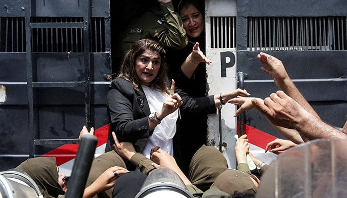A PTI supporter is being detained by police officers during a nationwide protest demanding Imran Khans release, on the second anniversary of his jailing, in Lahore on August 5, 2025. — Reuters