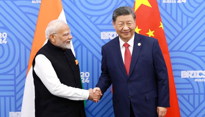 Chinese President Xi Jinping and India Prime Minister Narendra Modi meet on the sidelines of the BRICS summit in Kazan, Russia, October 23, 2024. — Reuters