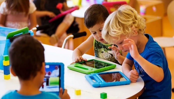 Children watch educational content on tablets at a preschool. —Reuters/File